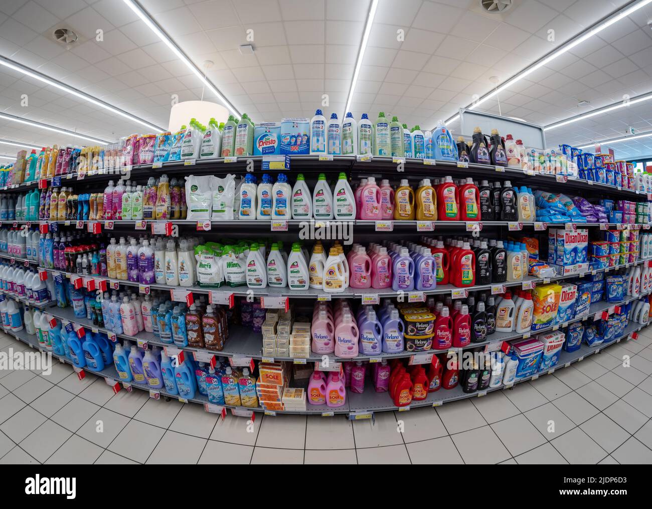 Fossano, Italy - June 07, 2022: Shelves with detergents and products for the washing machine in Italian supermarket. Fish eye vision Stock Photo
