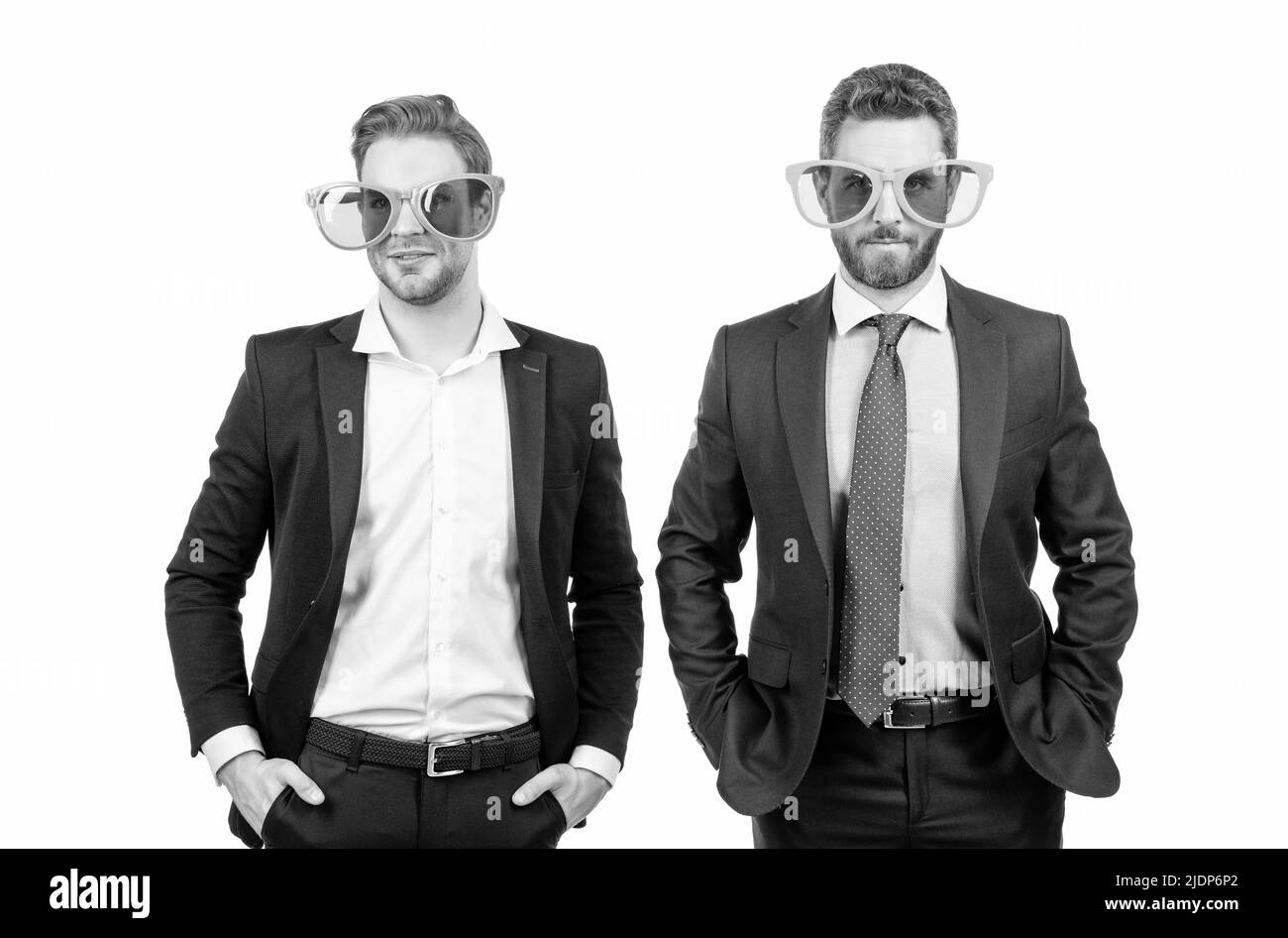 Work all day, party all night. Professional men wear funny glasses. Corporate party Stock Photo