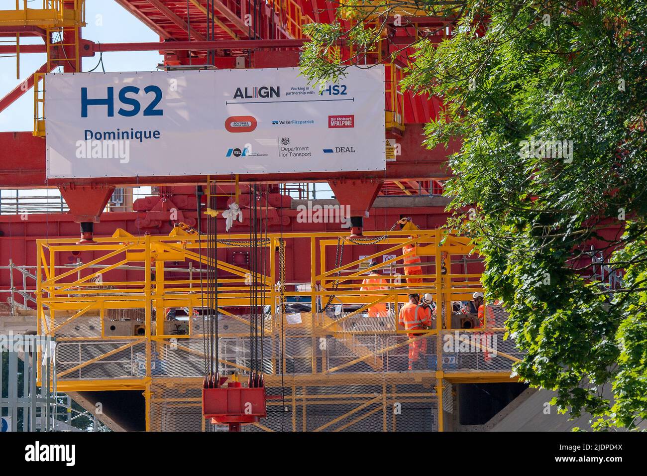 Denham, Buckinghamshire, UK. 22nd June, 2022. A 700 tonne orange coloured launch girder machine called Dominique has started to winch some of the pre cast concrete bridge segments into place onto the first of 56 pier segments for the HS2 High Speed 2 Colne Valley Viaduct. The Colne Valley Viaduct will be longest railway bridge in the UK. Credit: Maureen McLean/Alamy Live News Stock Photo