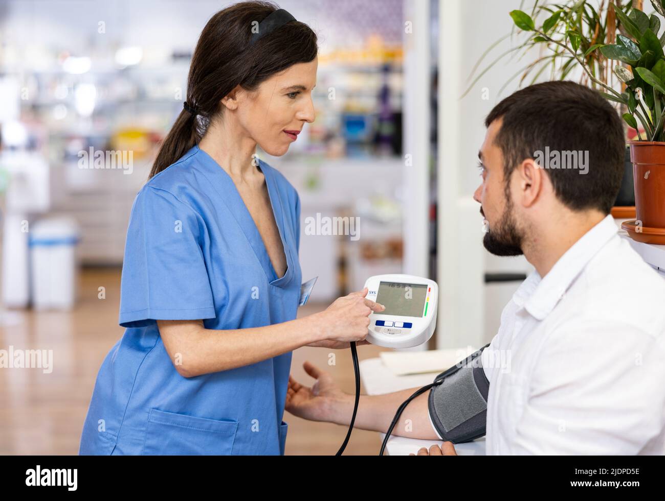 Male nurse checking blood pressure hi-res stock photography and images ...