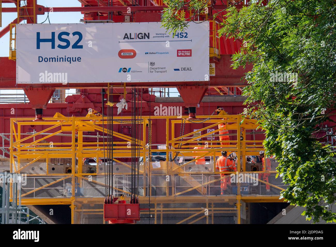 Denham, Buckinghamshire, UK. 22nd June, 2022. A 700 tonne orange coloured launch girder machine called Dominique has started to winch some of the pre cast concrete bridge segments into place onto the first of 56 pier segments for the HS2 High Speed 2 Colne Valley Viaduct. The Colne Valley Viaduct will be longest railway bridge in the UK. Credit: Maureen McLean/Alamy Live News Stock Photo