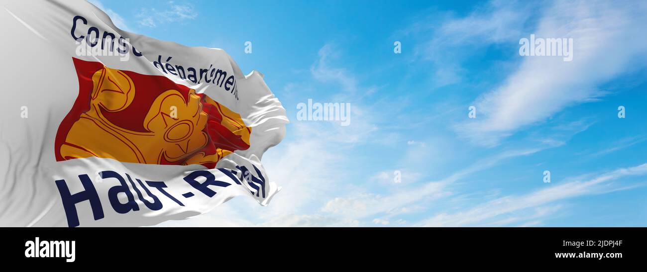 flag of department of Haut Rhin, France at cloudy sky background on