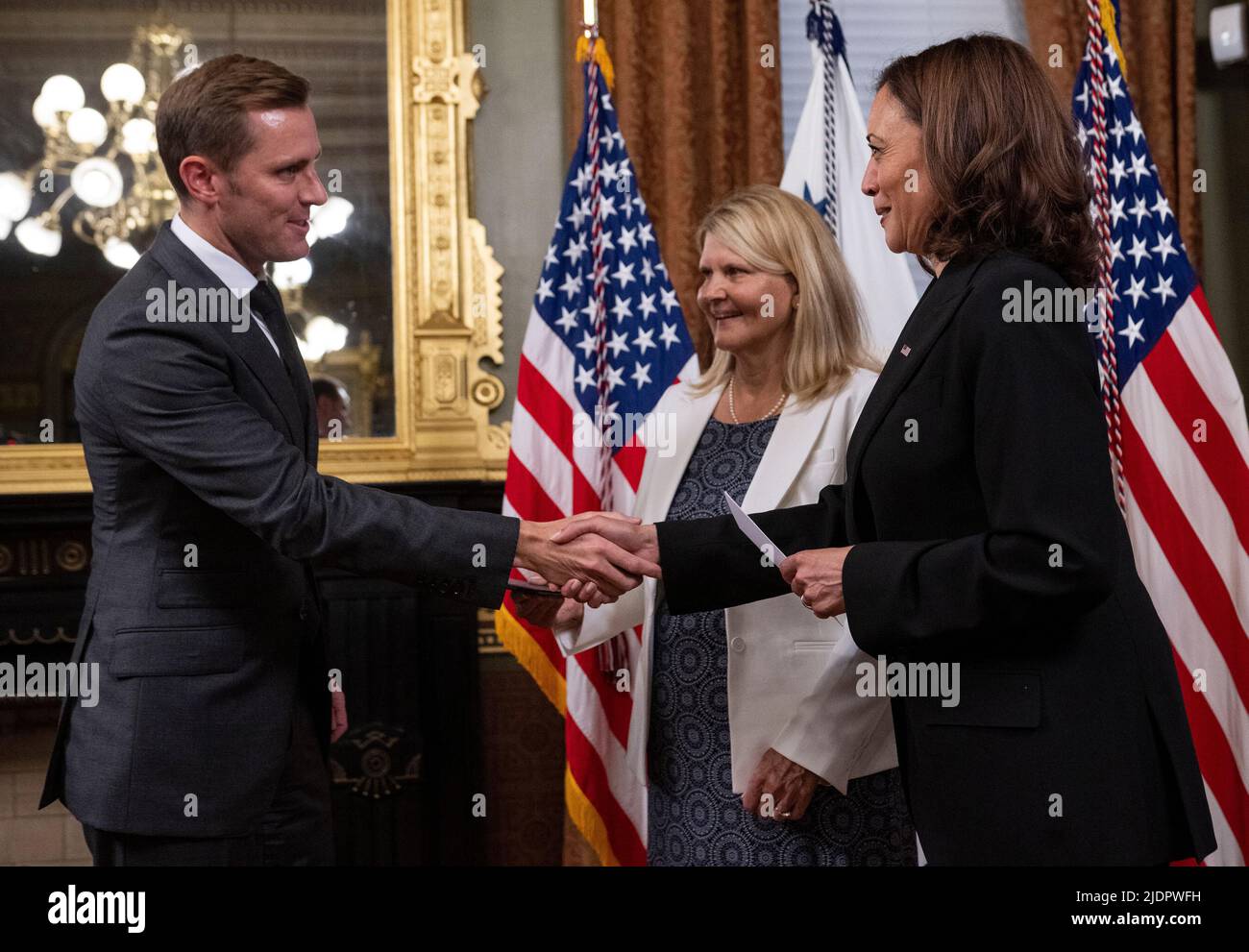 United States Vice President Kamala Harris ceremonially swears in Ambassador Scott Miller to be Ambassador Extraordinary and Plenipotentiary to the Swiss Confederation and to the Principality of Liechtenstein in the Vice Presidents Ceremonial Office in the Eisenhower Executive Office Building in Washington, DC on June 22, 2022. Millers mother, Beverly Ann Miller, center, holds a copy of the US Constitution. Credit: Ron Sachs/Pool via CNP Stock Photo