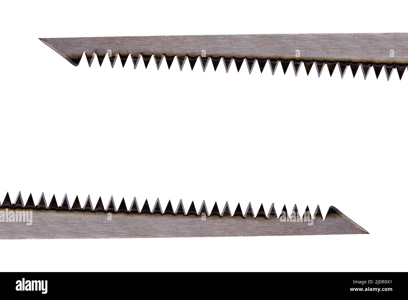 Two straight saw blades made of steel above and one below the surface pointing in different directions with long zigzag teeth and sharp pointed thin s Stock Photo Alamy
