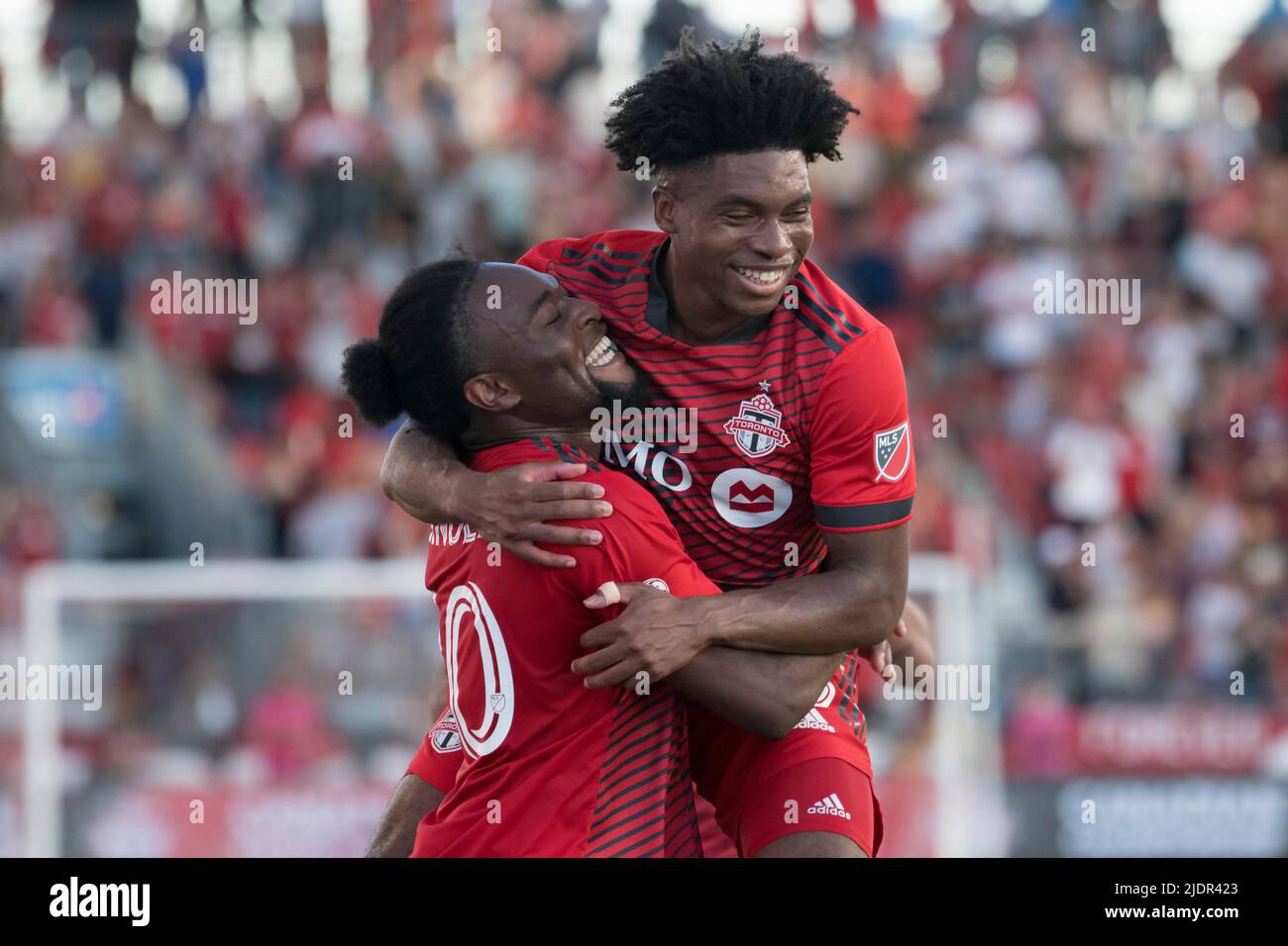 Toronto, Ontario, Canada. 22nd June, 2022. Ralph Priso-Mbongue (8) and Ayo Akinola (20) celebrates after Akinola scored a goal during the Canadian Championship game between Toronto FC and CF Montreal. The game ended 4-0 for Toronto FC. (Credit Image: © Angel Marchini/ZUMA Press Wire) Stock Photo