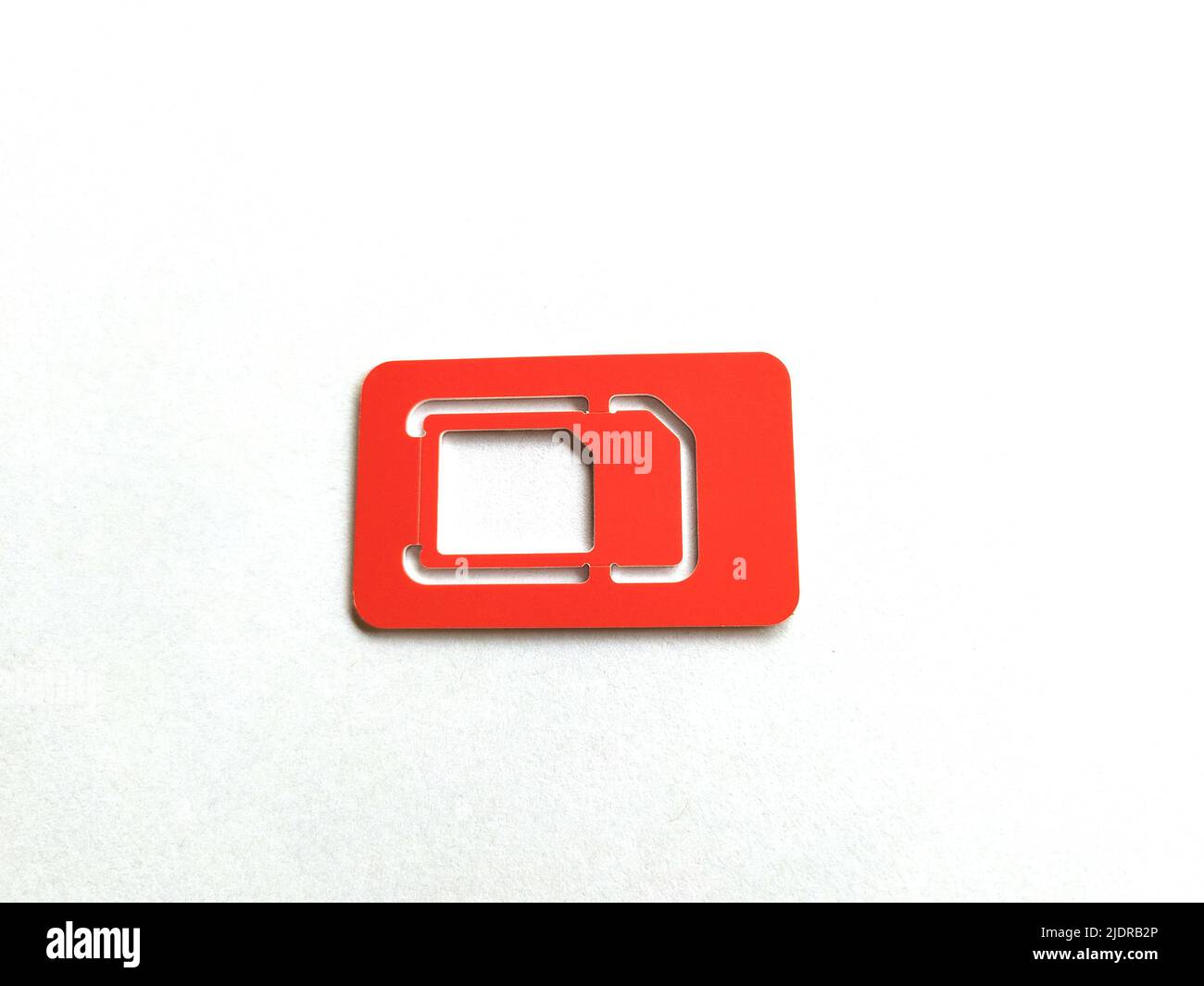 SIM Card, phone and slot on the white background, copy space, top view. Stock Photo