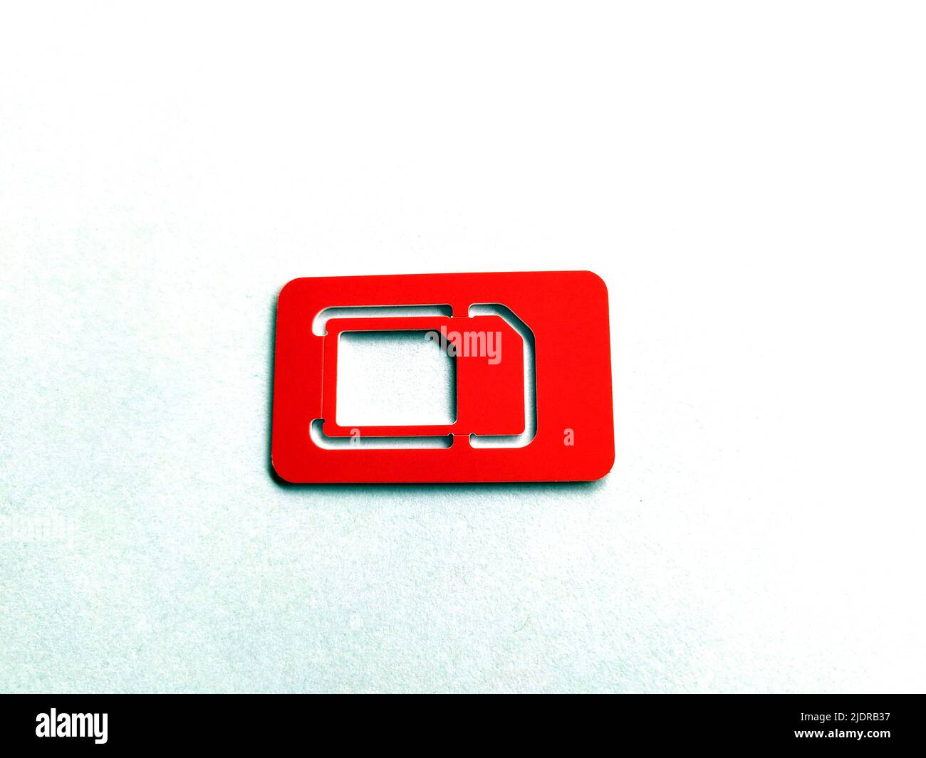 SIM Card, phone and slot on the white background, copy space, top view. Stock Photo
