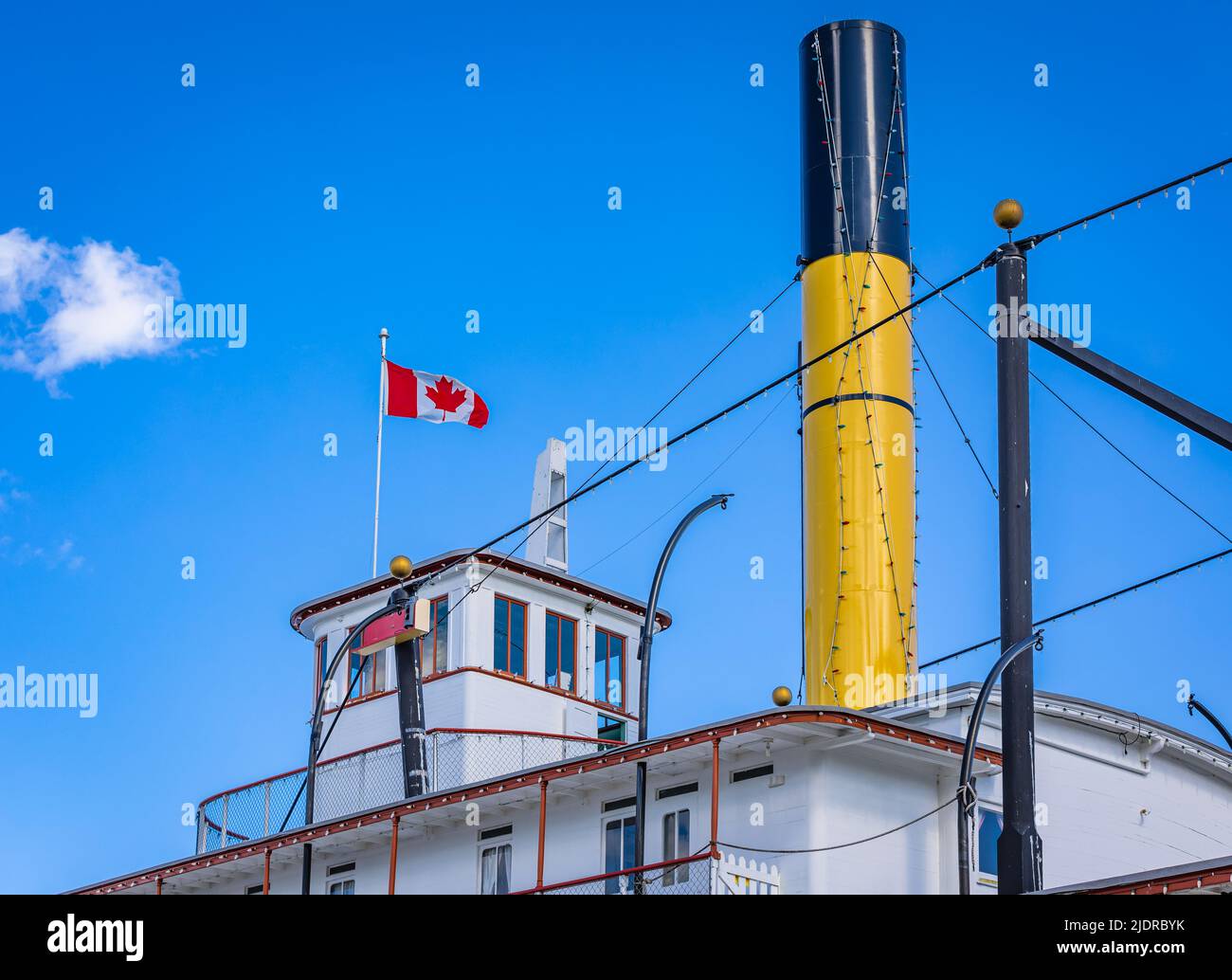 Funnel on old passenger ship on the blue sky background. Boat exhaust Stock Photo