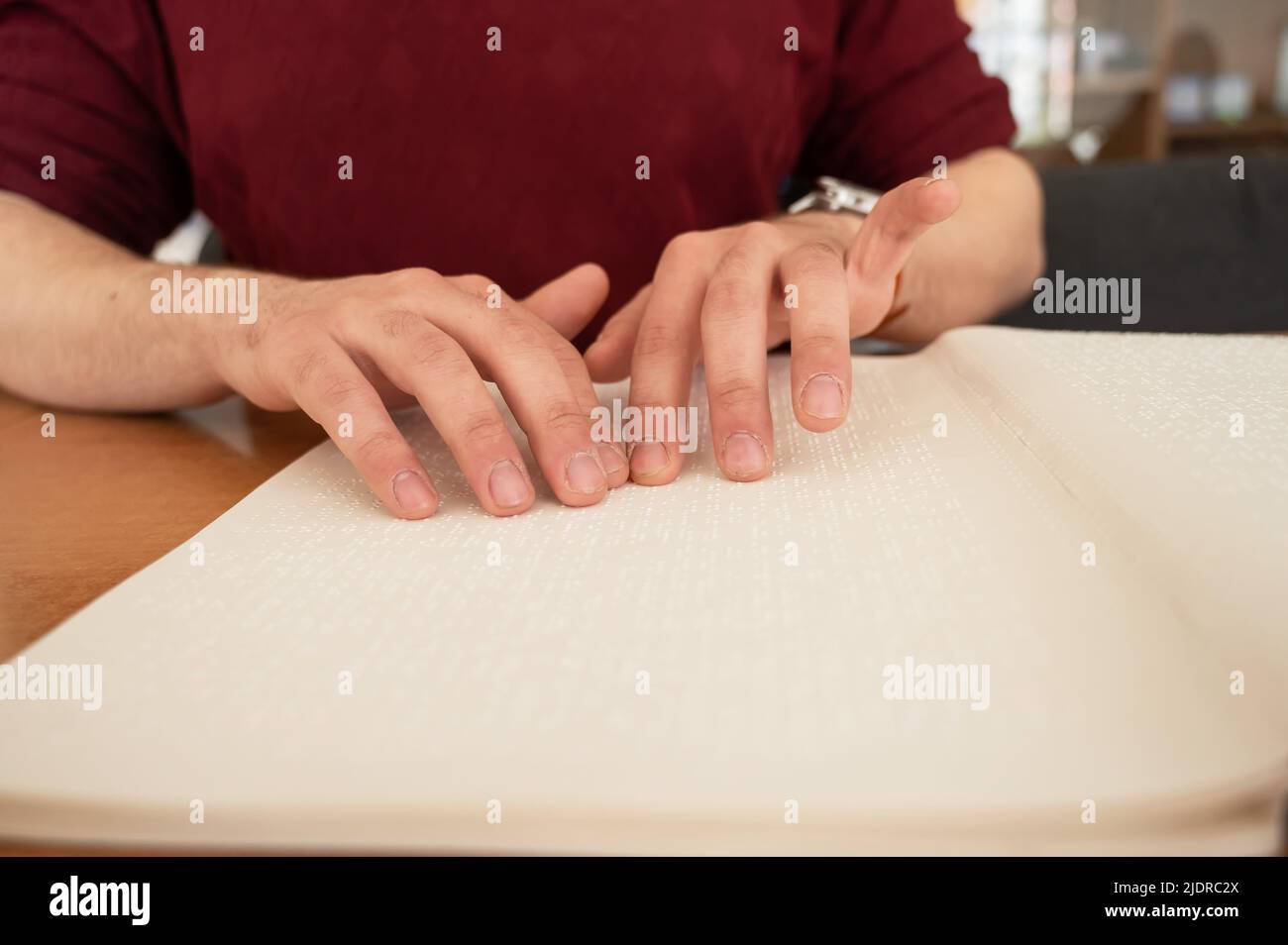 Visually impaired man reading a braille book Stock Photo Alamy
