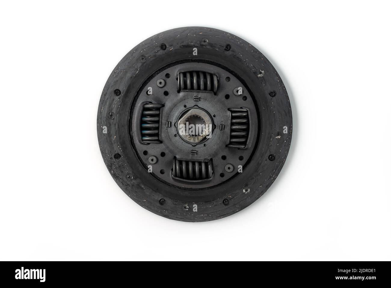 Worn old used clutch disc. Part of auto transmission.Isolated on white