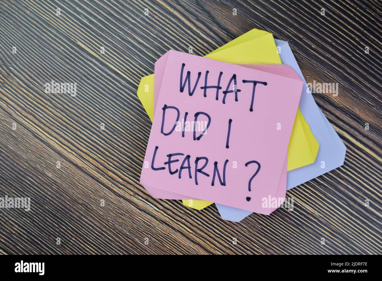 Concept of What Did I Learn? Personal Development write on sticky notes isolated on Wooden Table. Stock Photo