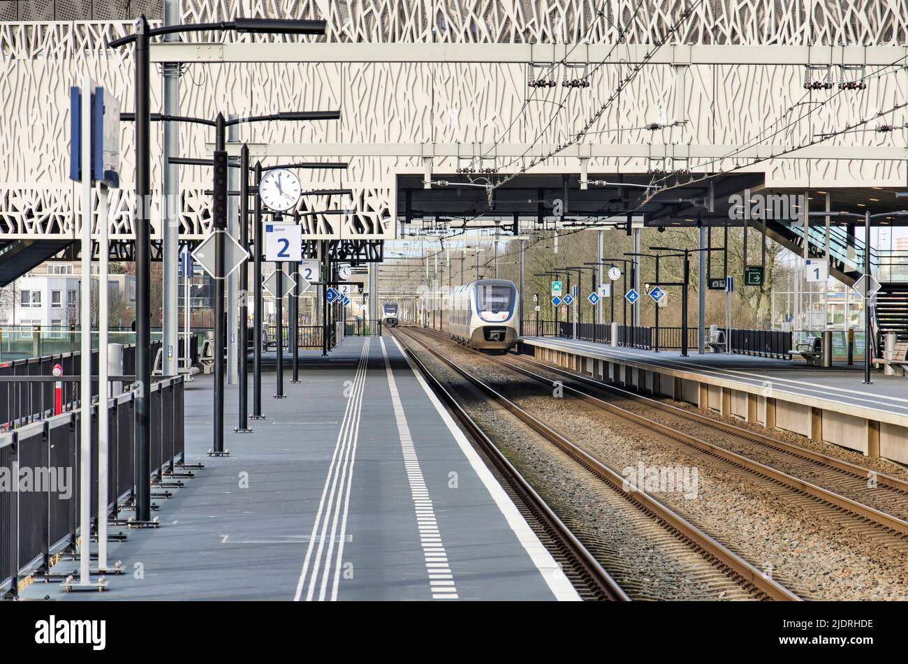 Zoetermeer, The Netherlands, January 30, 2022: two sprinter train approach and leave the Zoetermeer-Lansingerland railway station Stock Photo
