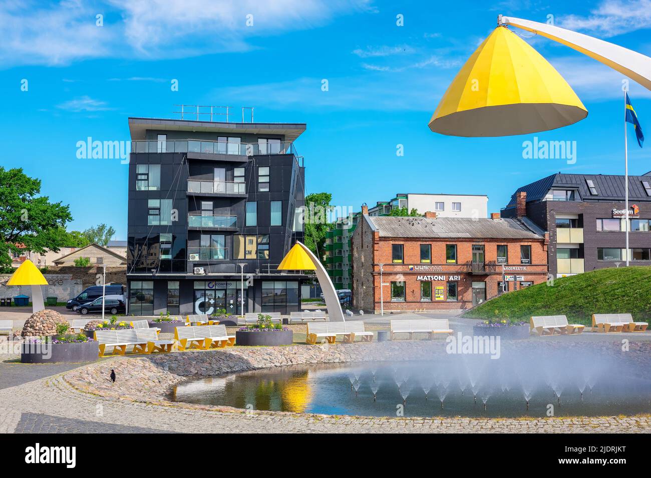 View to central square with fountain and modern yellow lanterns. Rakvere, Estonia Stock Photo