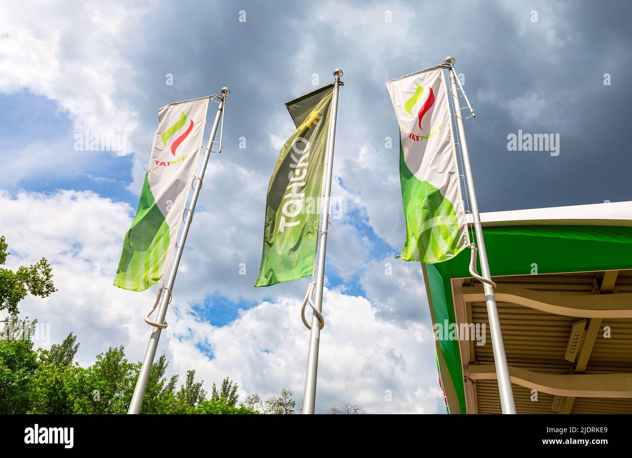 Samara, Russia - June 18, 2022: Flags with emblem of the oil company Tatneft on the gas station. Tatneft is one of the russian oil companies Stock Photo