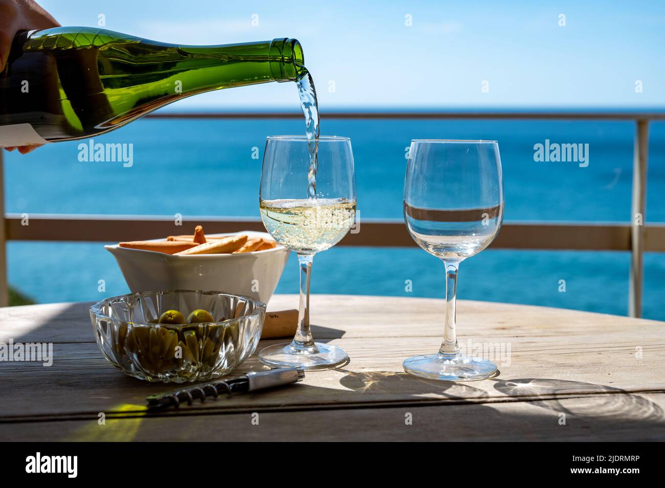 Pouring of txakoli or chacolí slightly sparkling very dry white wine