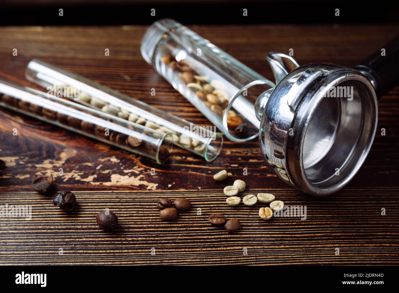 Tool for making professional espresso coffee and coffee beans on a wooden background Stock Photo