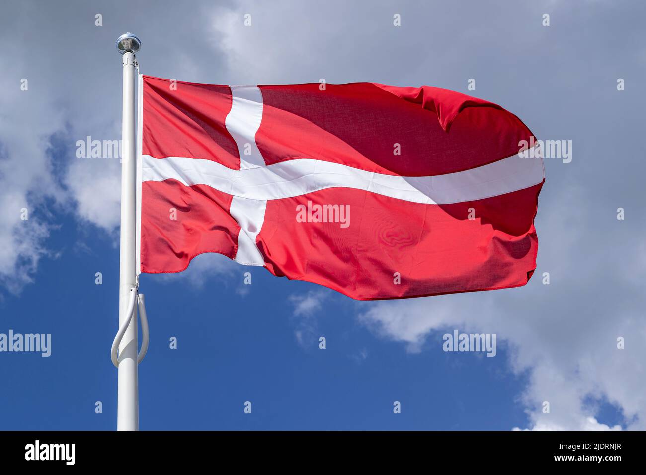flag of Denmark flying in the wind Stock Photo