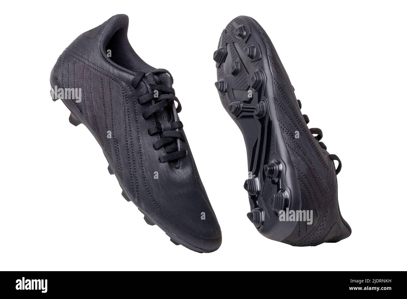 Closeup of a pair of black leather football boots isolated on white