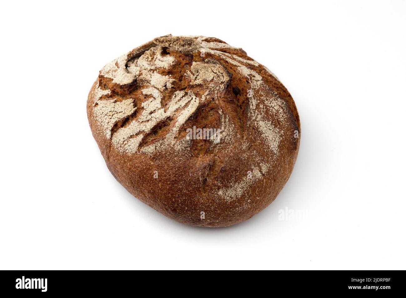 homemade freshly baked traditional rye bread isolated on white background, side view, round whole loaf of rustic organic cereal bread with crispy crus Stock Photo