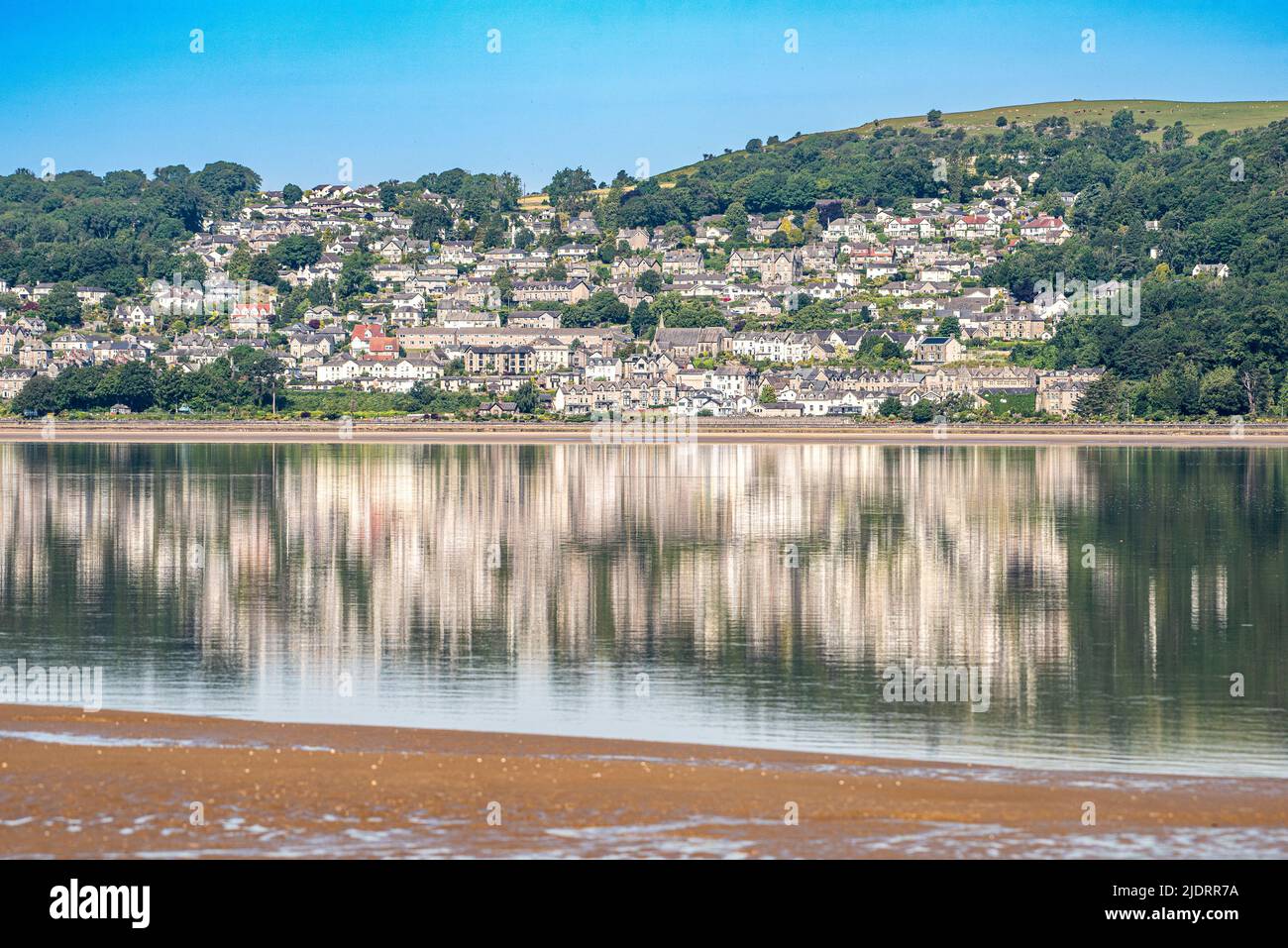 Grange-over-Sands, Cumbria, UK. 23rd June, 2022. Grange-over-Sands reflecting in the sea on a fine morning in Cumbria, UK. Credit: John Eveson/Alamy Live News Stock Photo