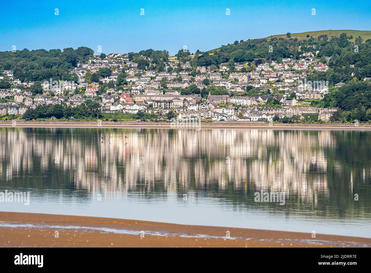 Grange-over-Sands, Cumbria, UK. 23rd June, 2022. Grange-over-Sands reflecting in the sea on a fine morning in Cumbria, UK. Credit: John Eveson/Alamy Live News Stock Photo