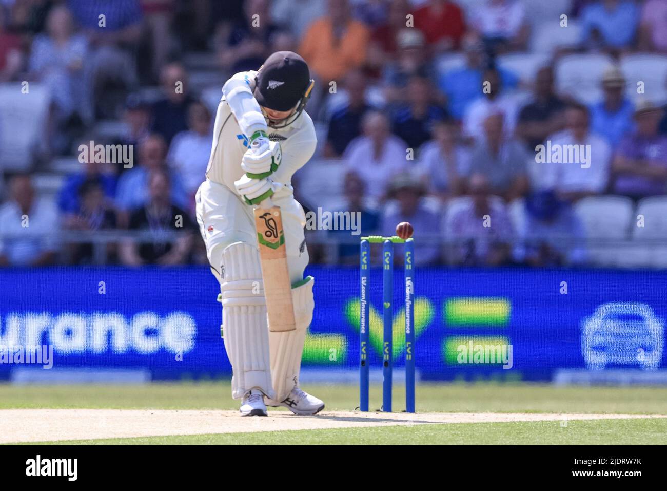 Leeds, UK. 23rd June, 2022. Tom Latham of New Zealand clips the ball and is caught by Joe Root of England in Leeds, United Kingdom on 6/23/2022. (Photo by Mark Cosgrove/News Images/Sipa USA) Credit: Sipa USA/Alamy Live News Stock Photo
