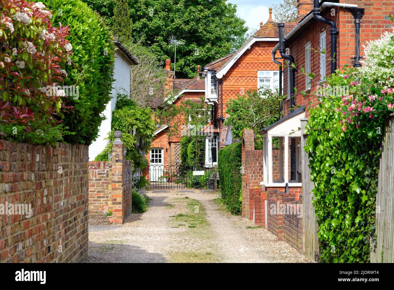 Secluded attractive old fashioned red tiled cottages in Herrings Lane Chertsey Surrey England UK Stock Photo