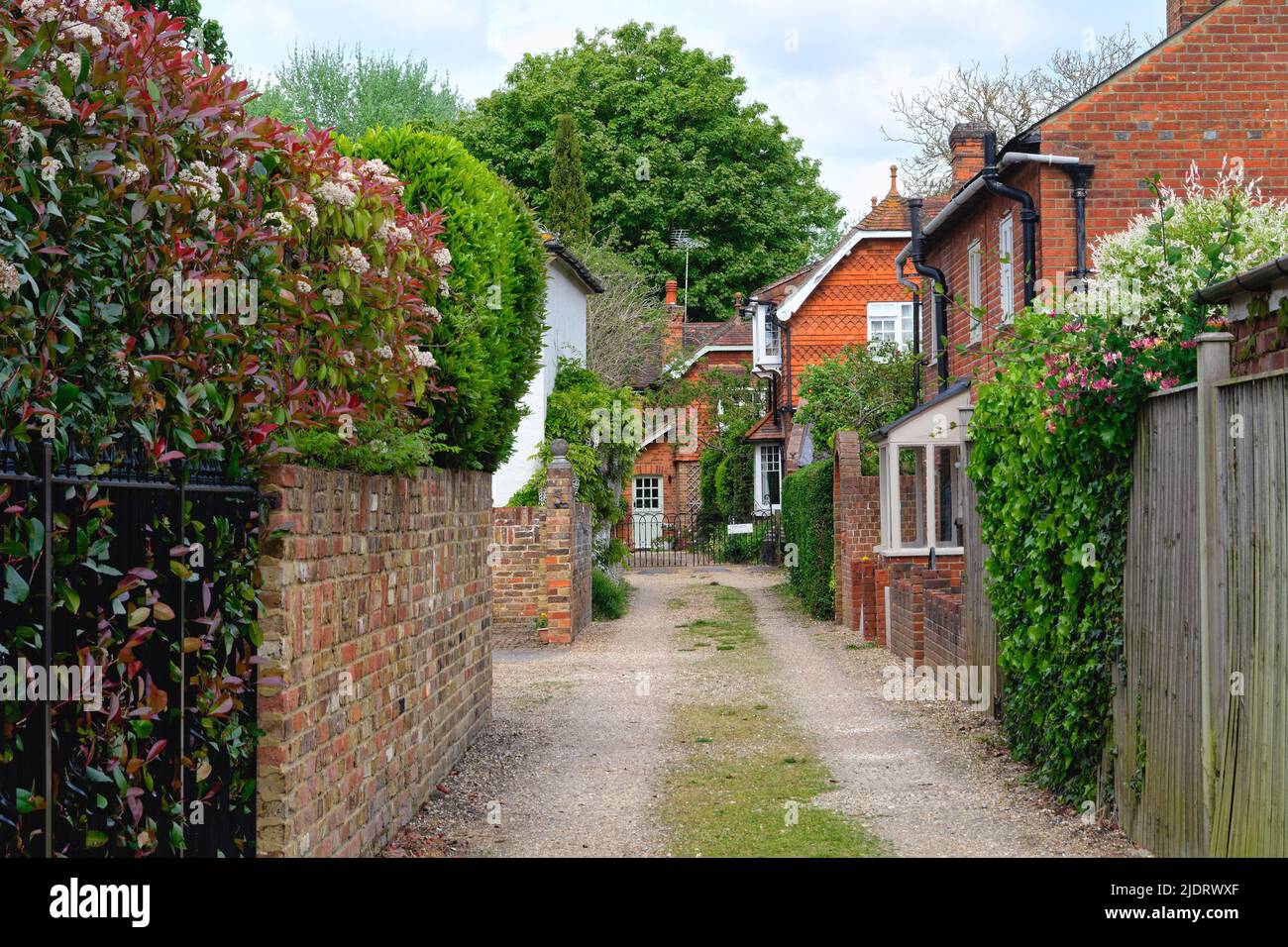 Secluded attractive old fashioned red tiled cottages in Herrings Lane Chertsey Surrey England UK Stock Photo