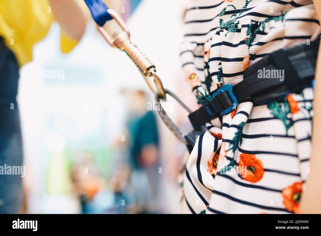 Climbing harness for kids. Child locking climbing carabiner. Climbing