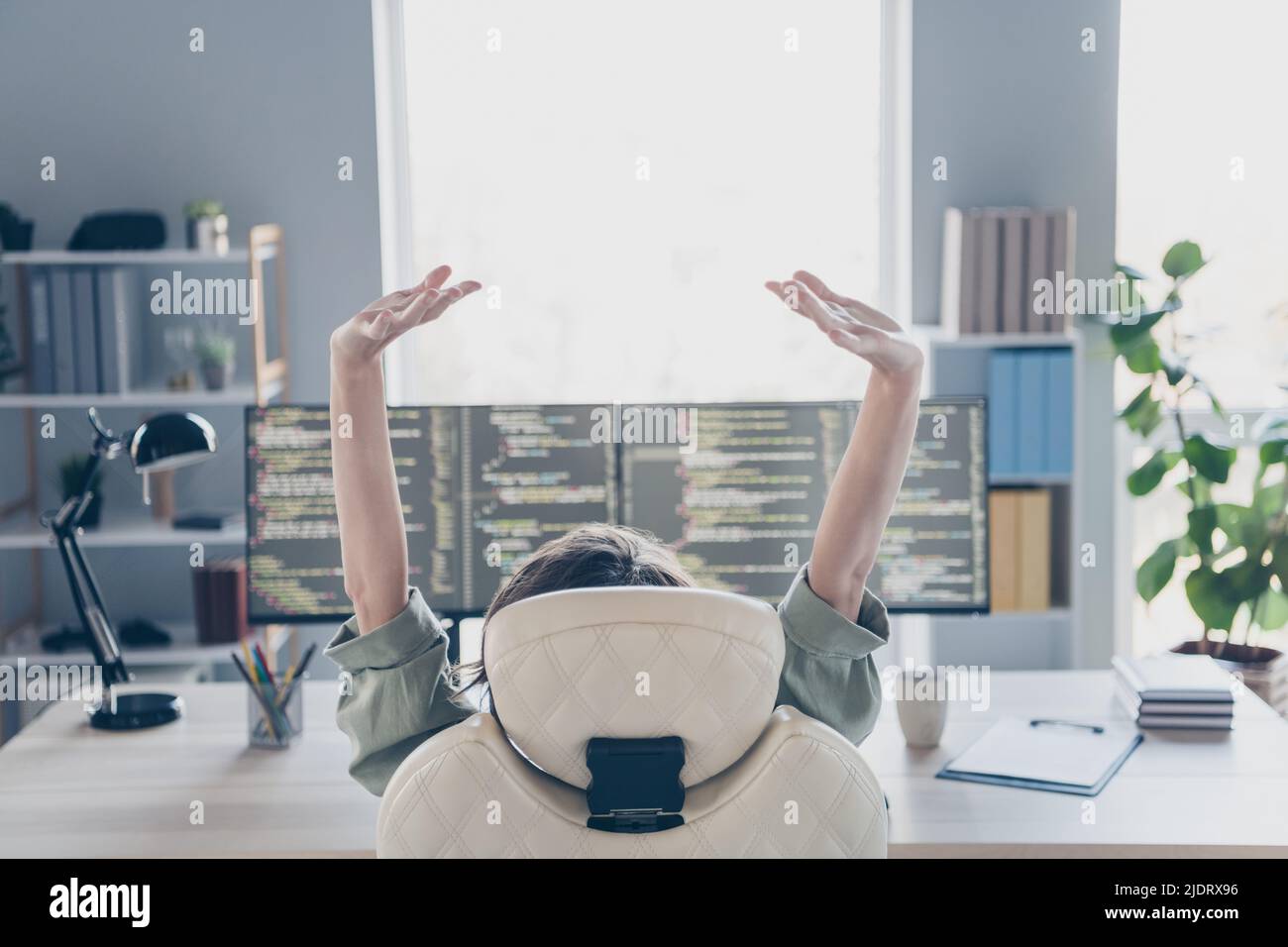 Rear behind portrait of hardware expert sitting chair raise stretch