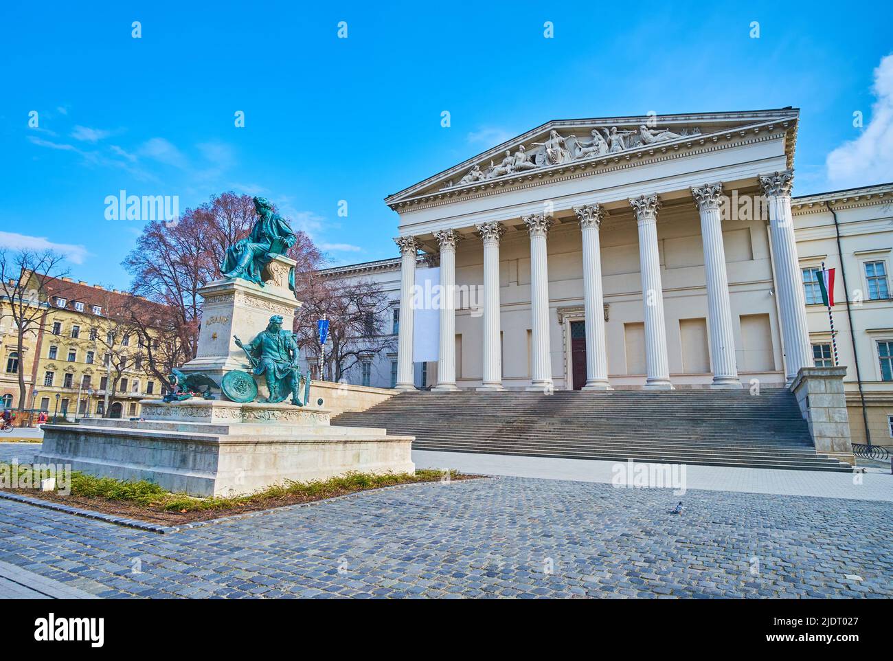 Architecural ensemble of Hungarian National Museum with statue of Janos Arany in the foreground, Budapest, Hungary Stock Photo