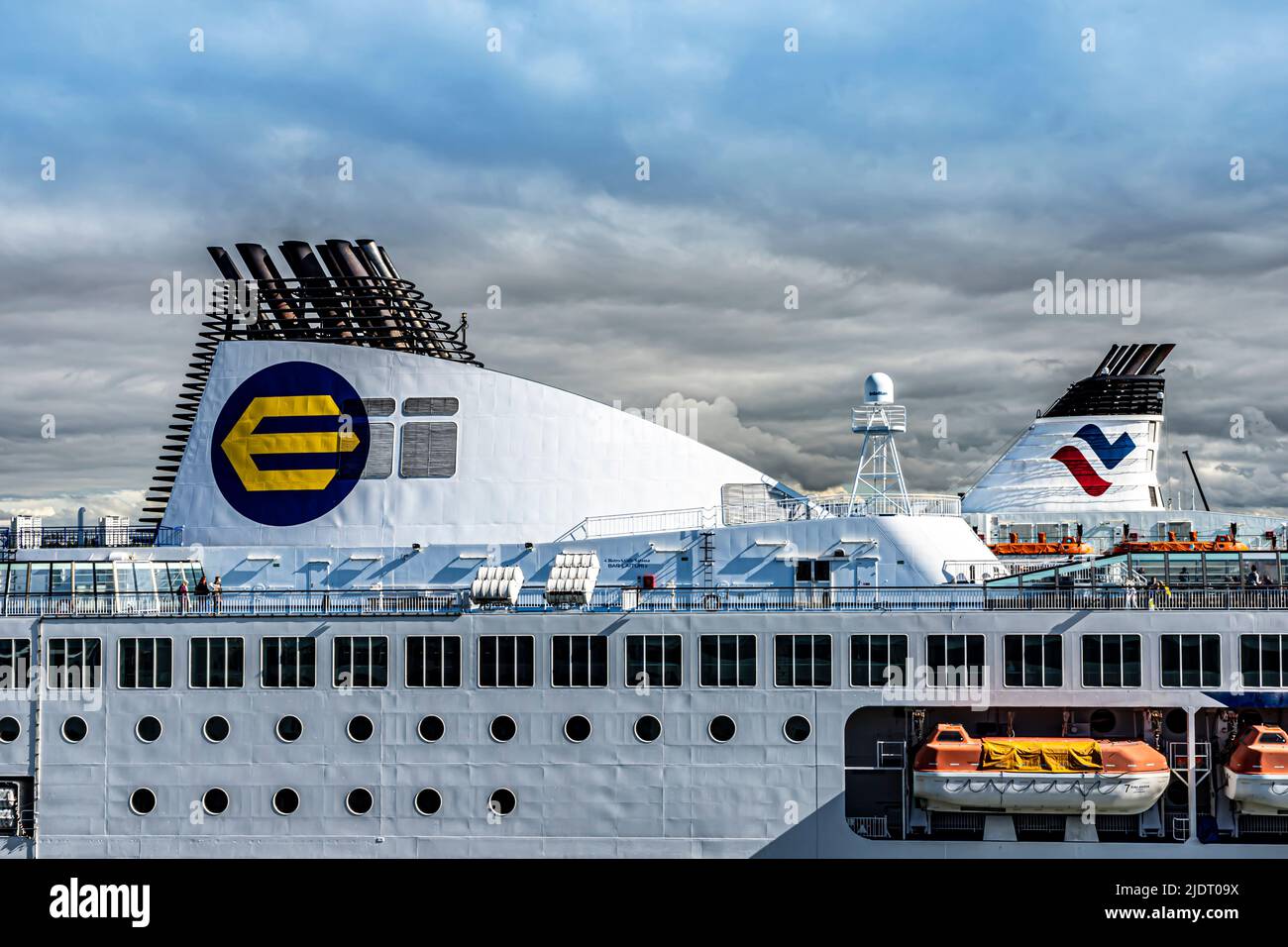 Eckerö Line and Tallink funnel colours on their respective cruiseferries in the Tallinn passenger port. Stock Photo