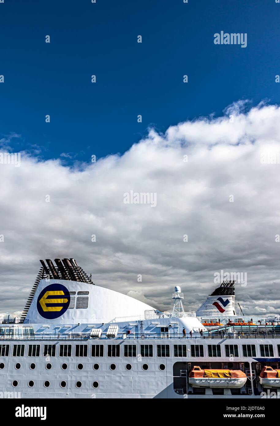 Eckerö Line and Tallink funnel colours on their respective cruiseferries in the Tallinn passenger port. Room for text. Stock Photo