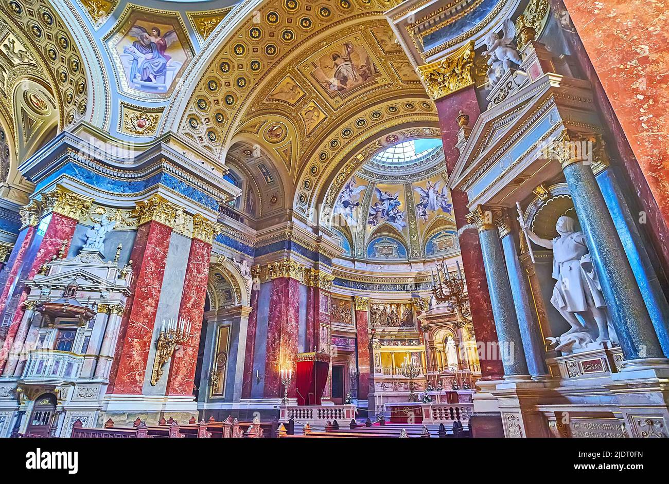 BUDAPEST, HUNGARY - FEB 27, 2022: The prayer hall and Sanctuary of St Stephen Cathedral with carved, painted and sculptured decorations, on Feb 27 in Stock Photo