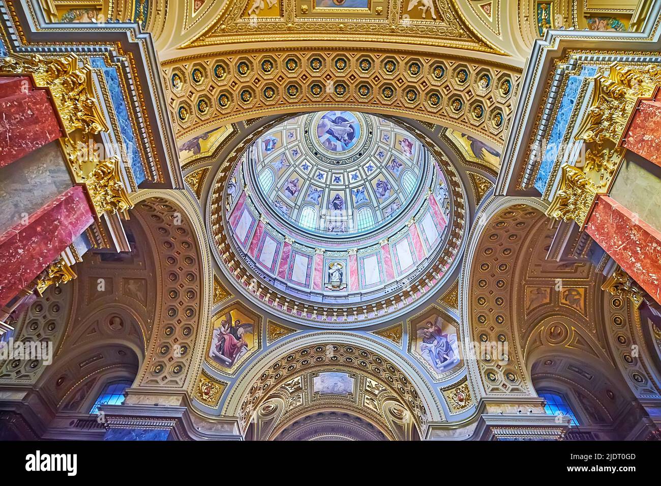 BUDAPEST, HUNGARY - FEB 27, 2022: Decorative details of interior of St Stephen's Cathedral with its main dome, arches, carvings and mosaics, on Feb 27 Stock Photo