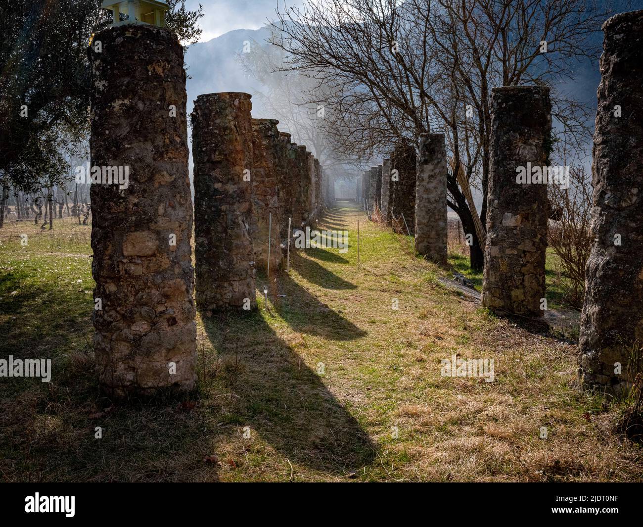15th century columns leading from the village of Villars-sur-Var to a panoramic overlook of the Provencal valley in the lower Alps above Nice, France. Stock Photo