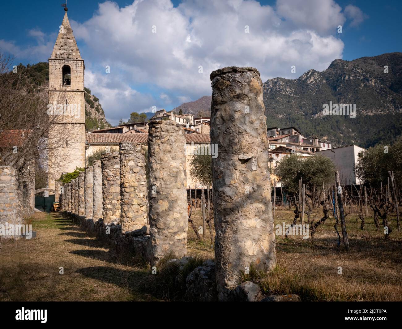 View of 30 historic columns coming from the village church with bell tower of Villars-sur-Var in the Alps-Maritimes province of southeastern France. Stock Photo