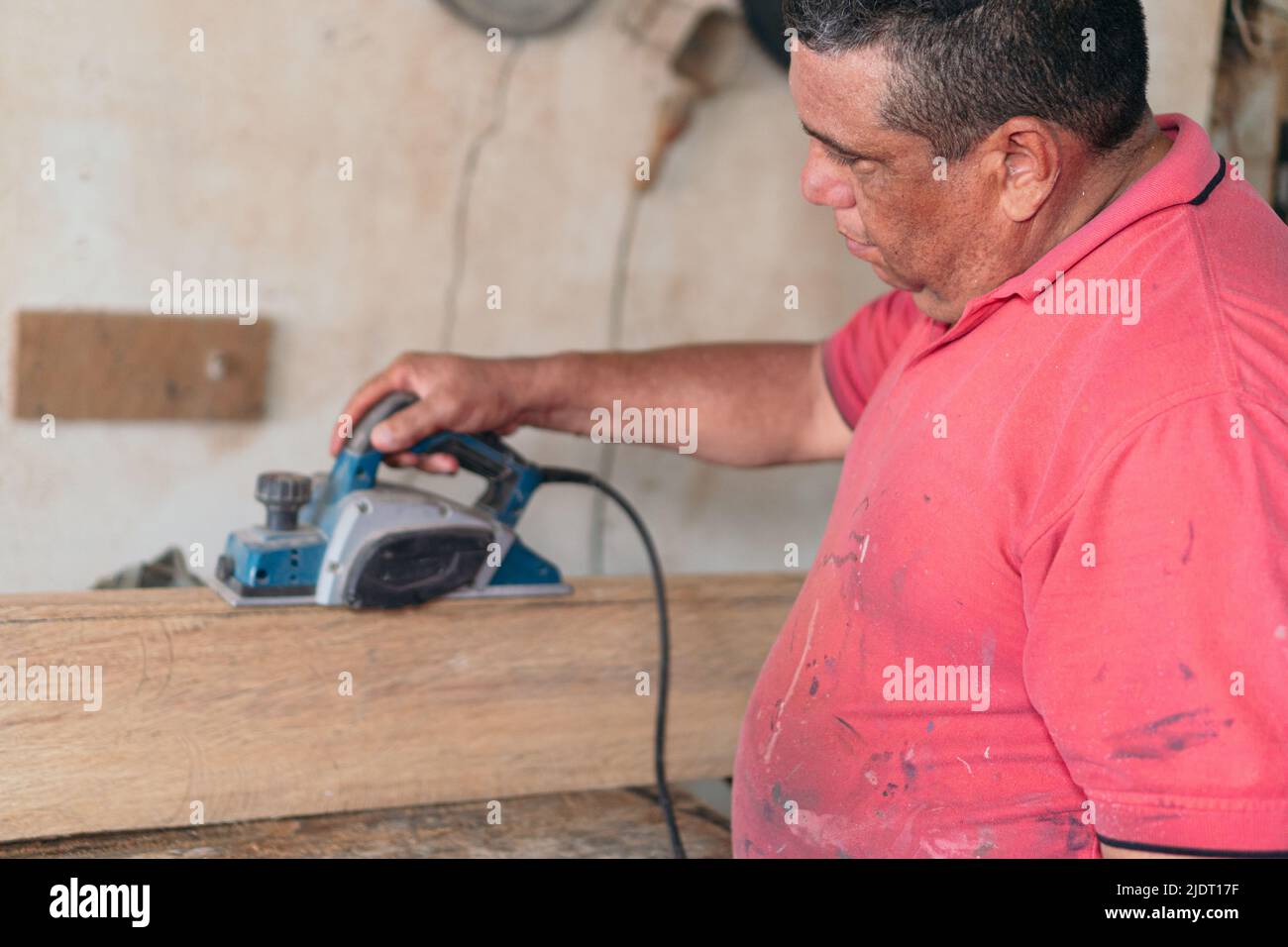 Latin carpenter in wood surrounded by tools Stock Photo Alamy