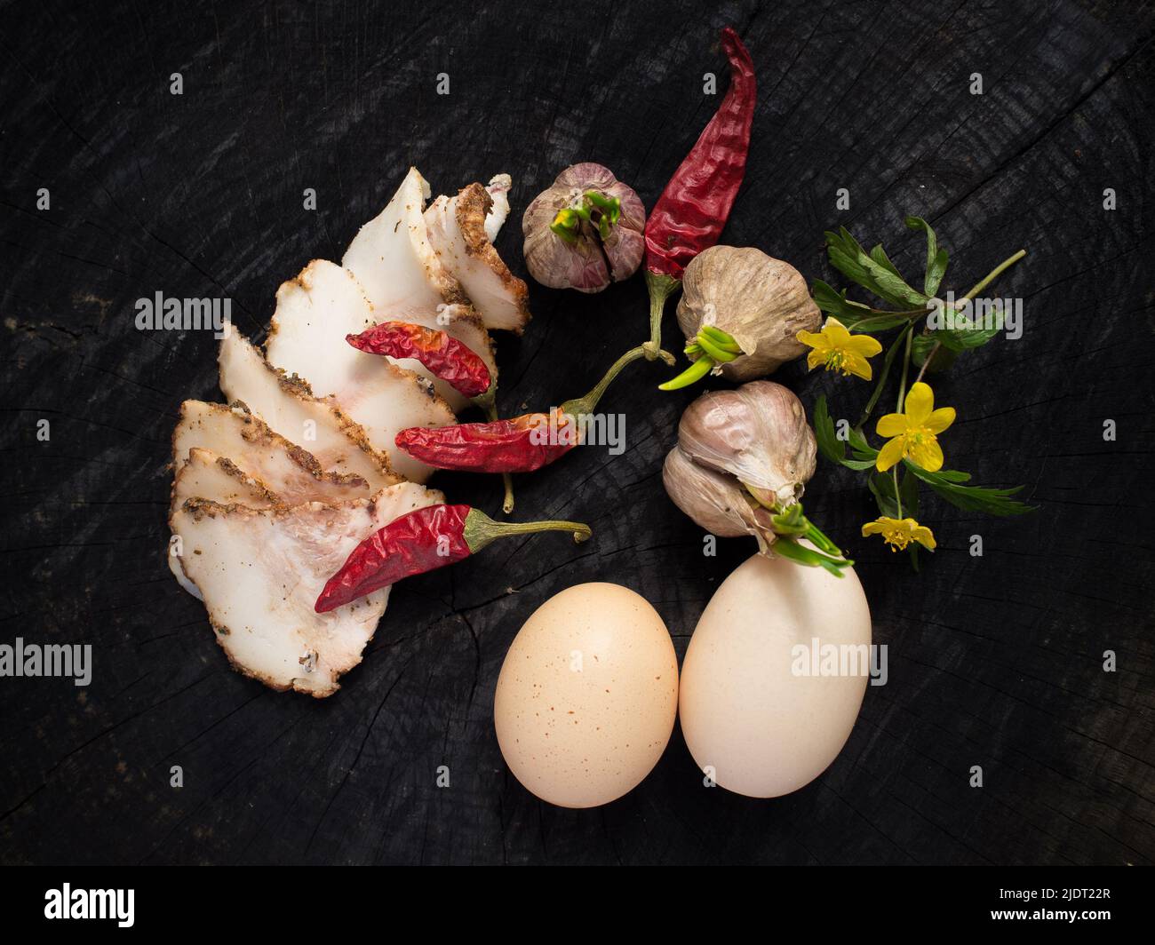 Bacon, garlic, eggs and pepper Stock Photo