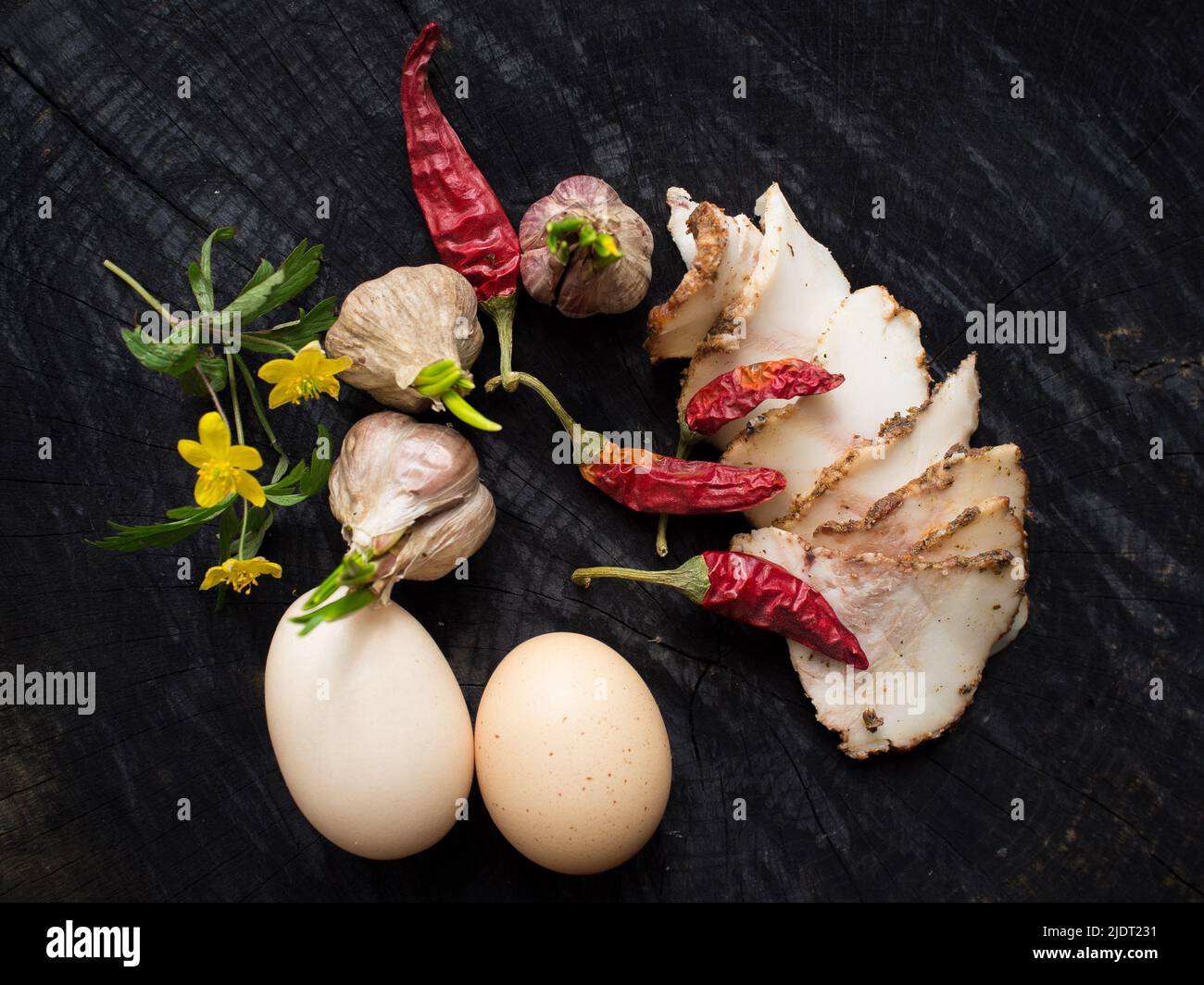Bacon, garlic, eggs and pepper Stock Photo