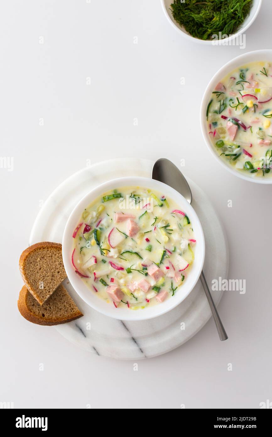 Cold soup Okroshka, soup with fresh vegetables and kefir, delicious summer traditional Ukrainian or Russian soup Stock Photo