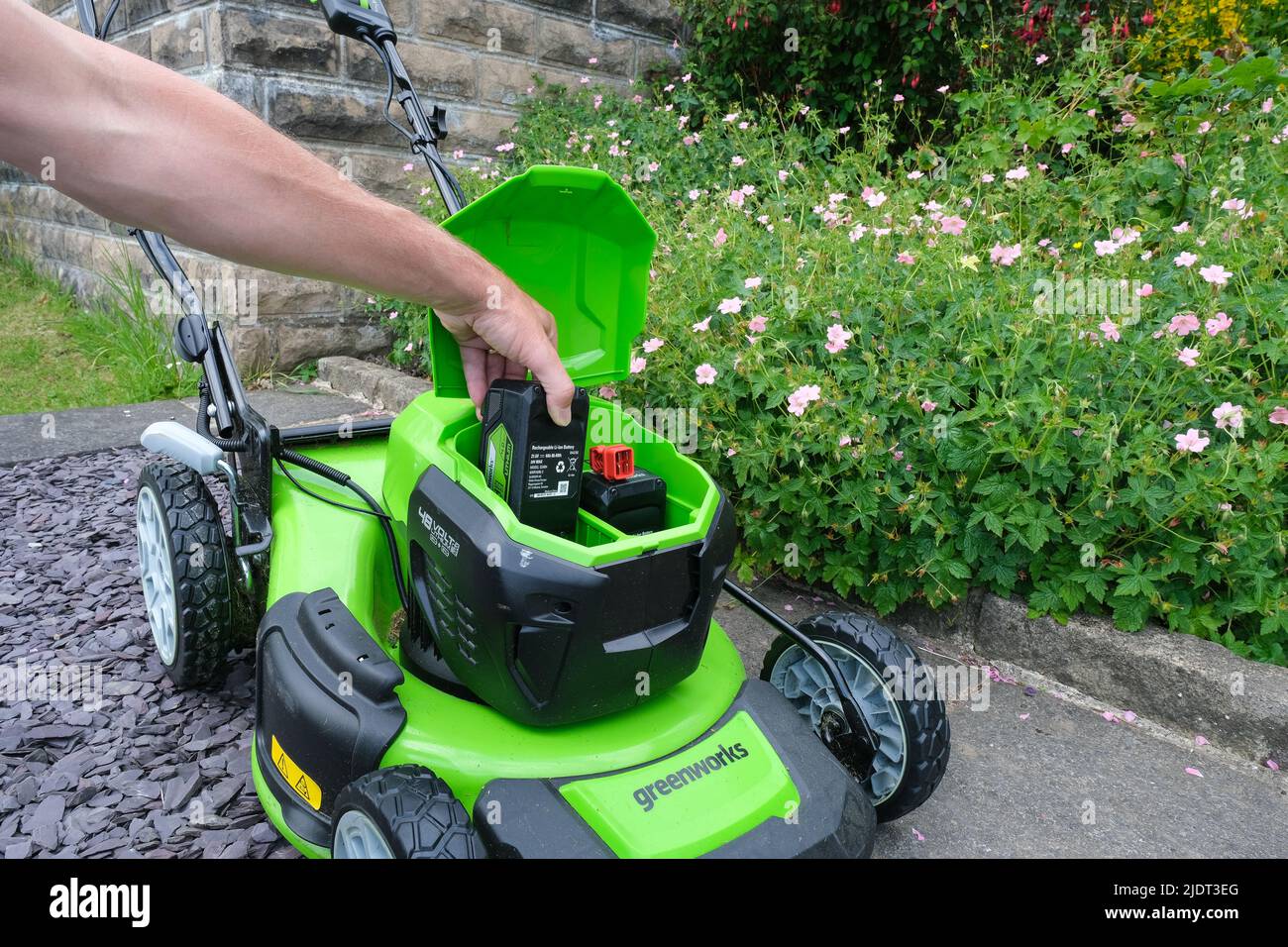 A Greenworks Lithium battery-powered Lawnmower. Stock Photo
