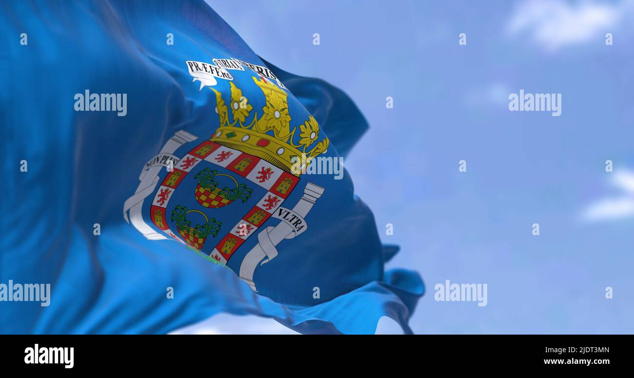 Rear view of Mellla city flag waving in the wind on a clear day. Melilla is one of two autonomous cities of Spain, located in north Africa country. Se Stock Photo