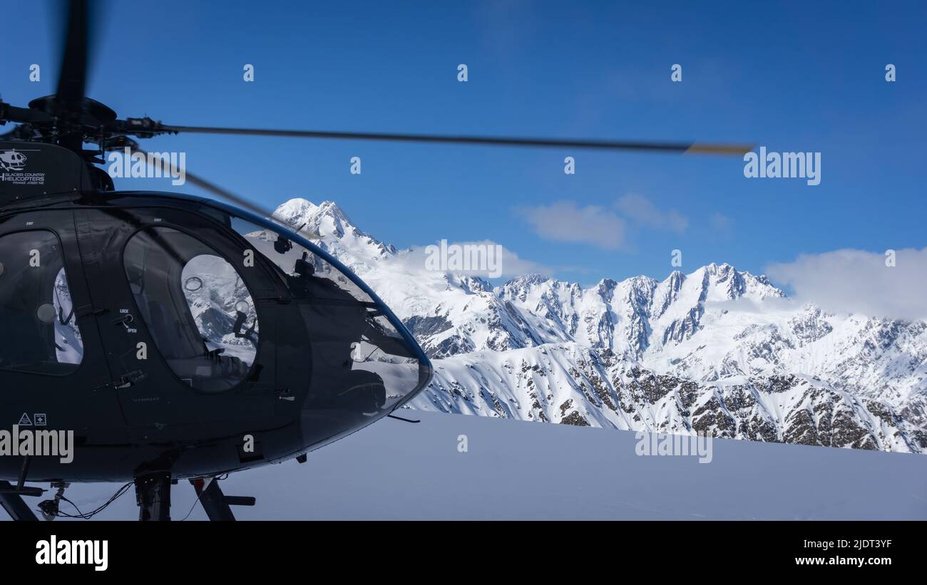 Franz Josef Helicopter on top of a Snowy Mountain Stock Photo