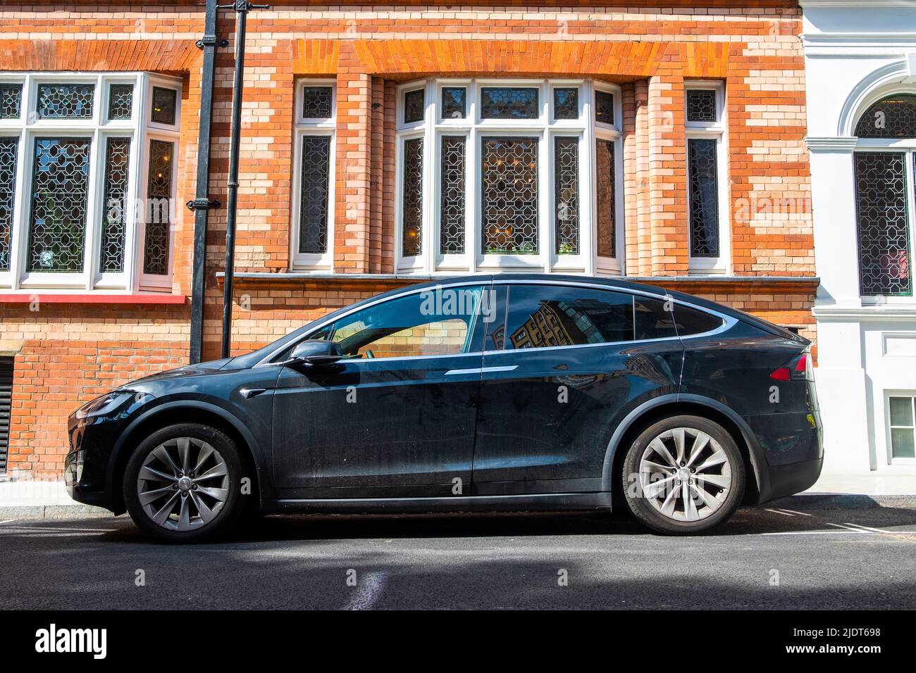London- May 2022: Telsa Model X parked on upmarket London street Stock Photo