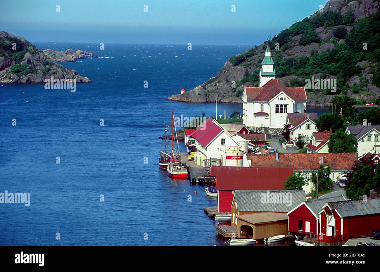 The village of Kirkehamn (Church Harbor) on the island of Hidra in south-western Norway.  The church has named the village and dates back to 1854 alth Stock Photo