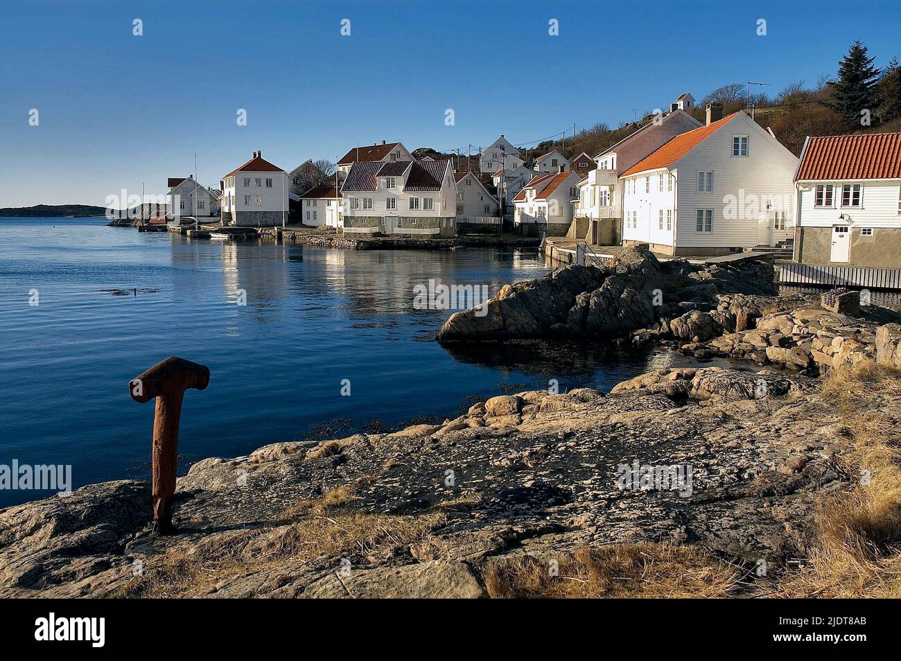 Traditional houses in the coastal village of Loshavn close to the southernmost tip of Norway.  A typical tourists place that was populated permanently Stock Photo