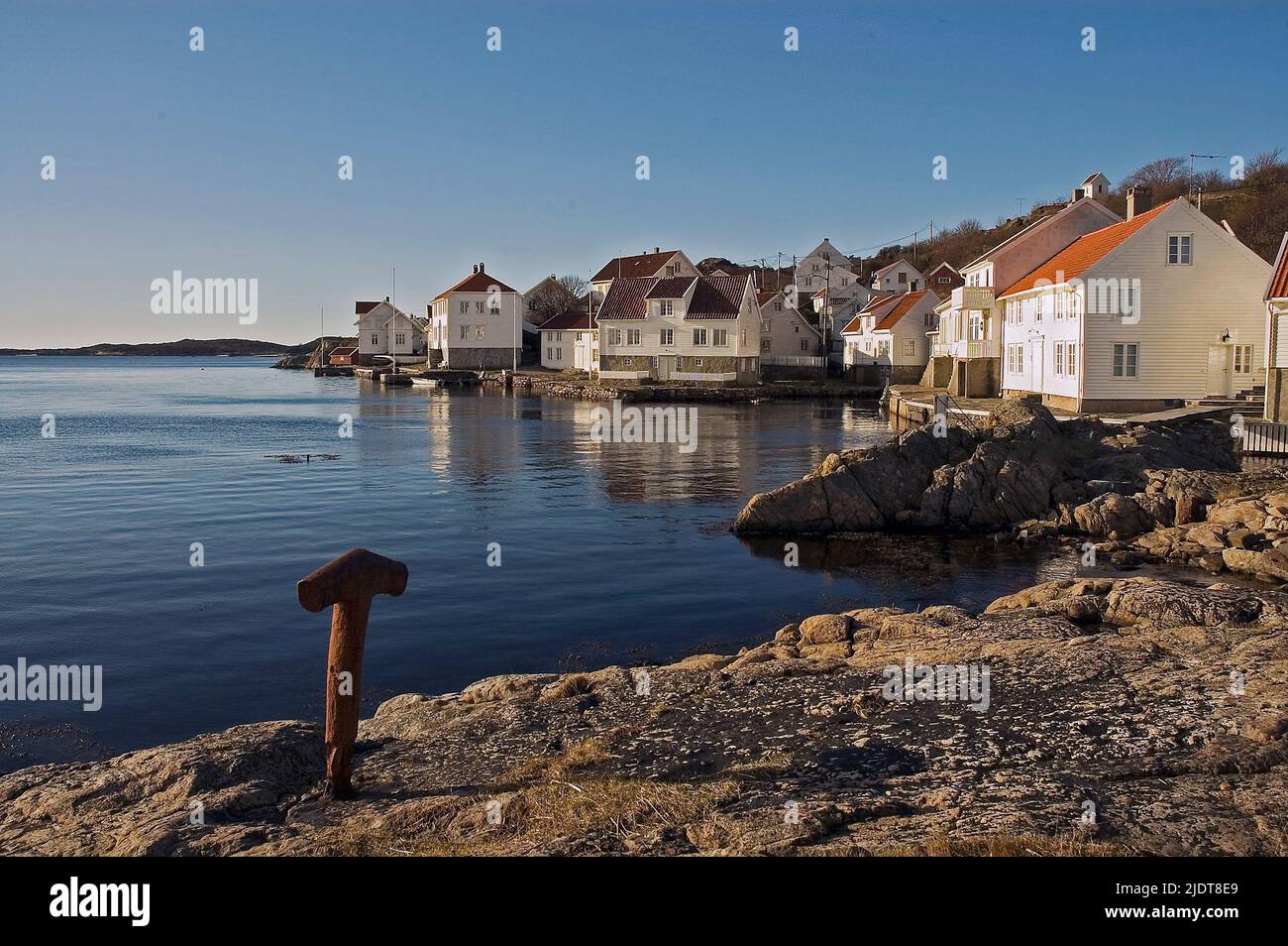 Traditional houses in the coastal village of Loshavn close to the southernmost tip of Norway.  A typical tourists place that was populated permanently Stock Photo