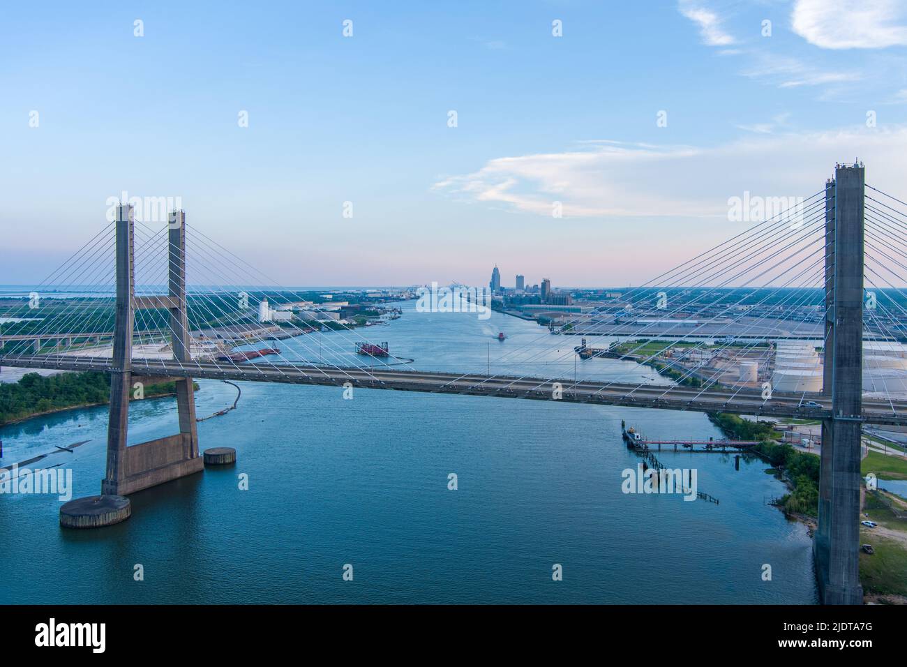 The Cochrane Bridge and the port of Mobile, Alabama at sunset Stock Photo