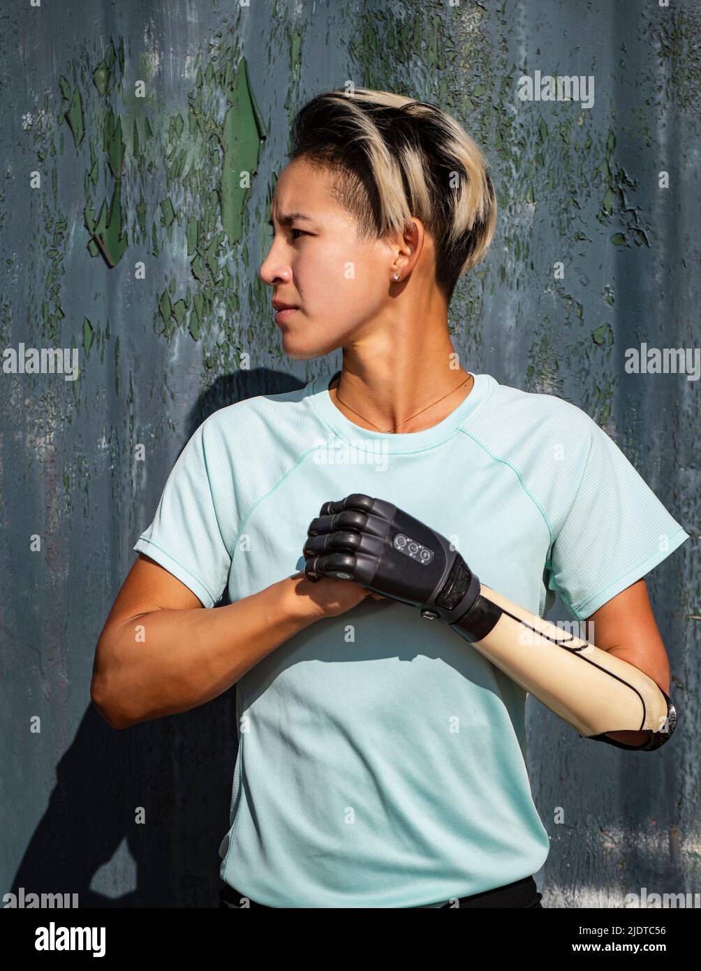 Portrait of athletic woman with prosthetic arm Stock Photo